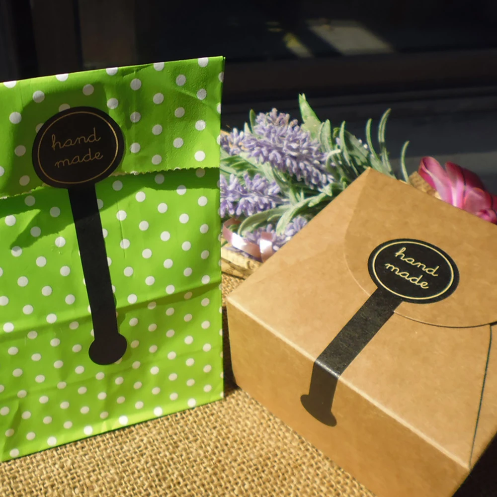 Long Adhesive "HAND MADE" Stickers – Black Kraft Sealing Labels for Handmade Cake Boxes, Bakery Bags, DIY Gift Packaging – Durable Craft Stickers for Homemade Products and Small Biz Use Long Adhesive "HAND MADE" Stickers – Black Kraft Sealing Labels for Handmade Cake Boxes, Bakery Bags, DIY Gift Packaging – Durable Craft Stickers for Homemade Products and Small Biz Use