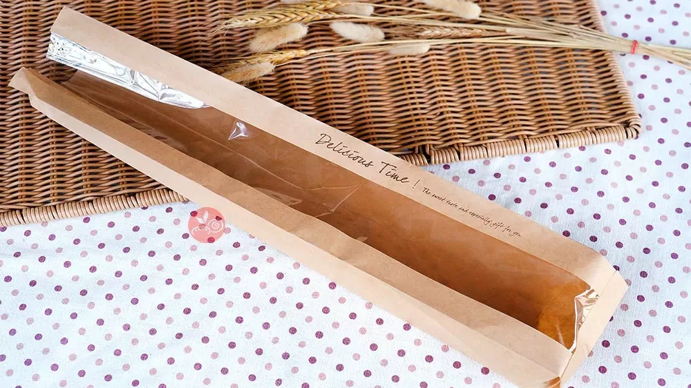 Professional bakery packaging display showing kraft paper bags with transparent windows