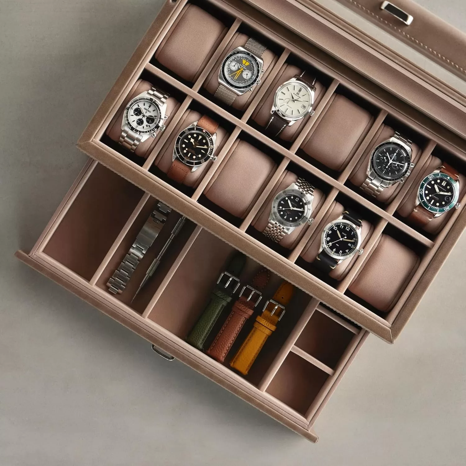 Overhead view of an open Luxury Watch Box, showcasing its elegant interior layout, soft watch cushions, and premium storage compartments for display.